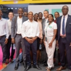 Lors du Salon des Maires à l’Université de Guyane, une délégation de l’université pose devant son stand, entourée de représentants et partenaires locaux. On aperçoit le logo « UG » (Université de Guyane) en arrière-plan, ainsi que des éléments de communication liés aux métiers et initiatives universitaires locales. Cette image illustre la participation institutionnelle, les échanges entre acteurs publics et universitaires, et l’implication de l’Université de Guyane dans le développement territorial.
